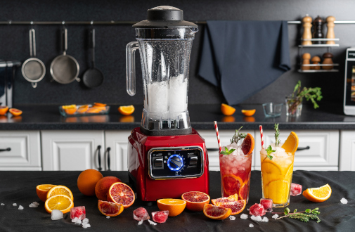 A blender and 2 cocktails placed in a kitchen