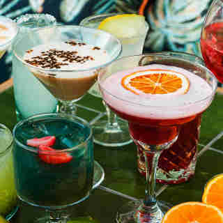 Different colorful cocktails with fruit pieces